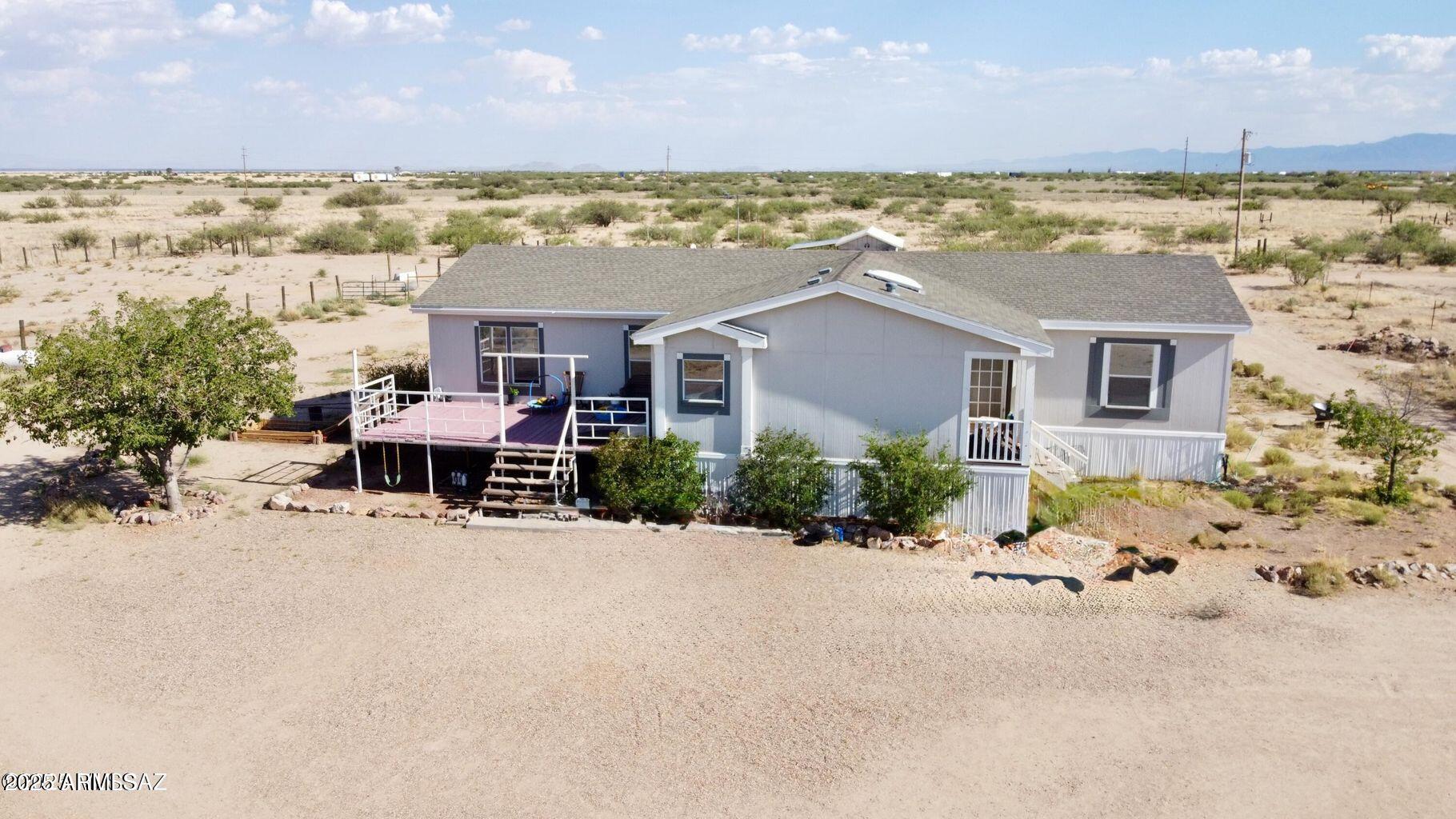 2627 West Hansen Road Willcox, AZ 85643 - Photo 3 of 42 a view of an ocean with a building in the background