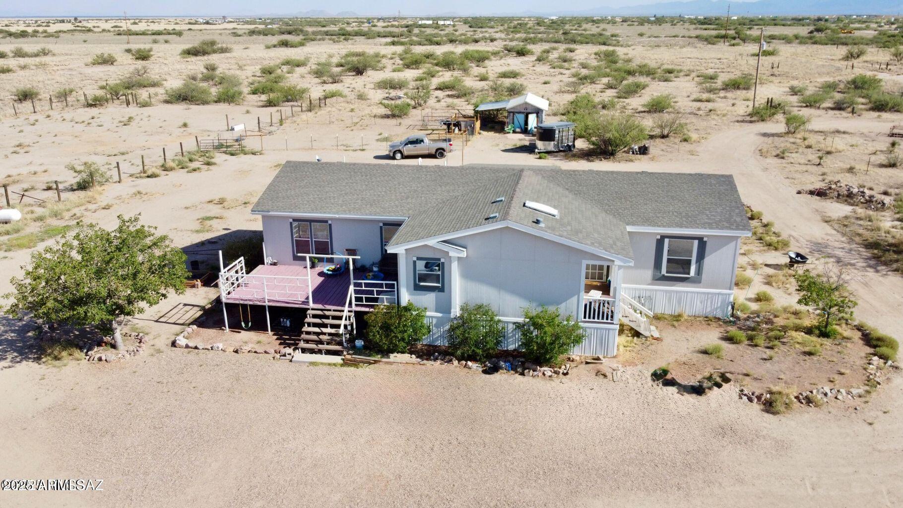 2627 West Hansen Road Willcox, AZ 85643 - Photo 4 of 42 an aerial view of a house with a yard