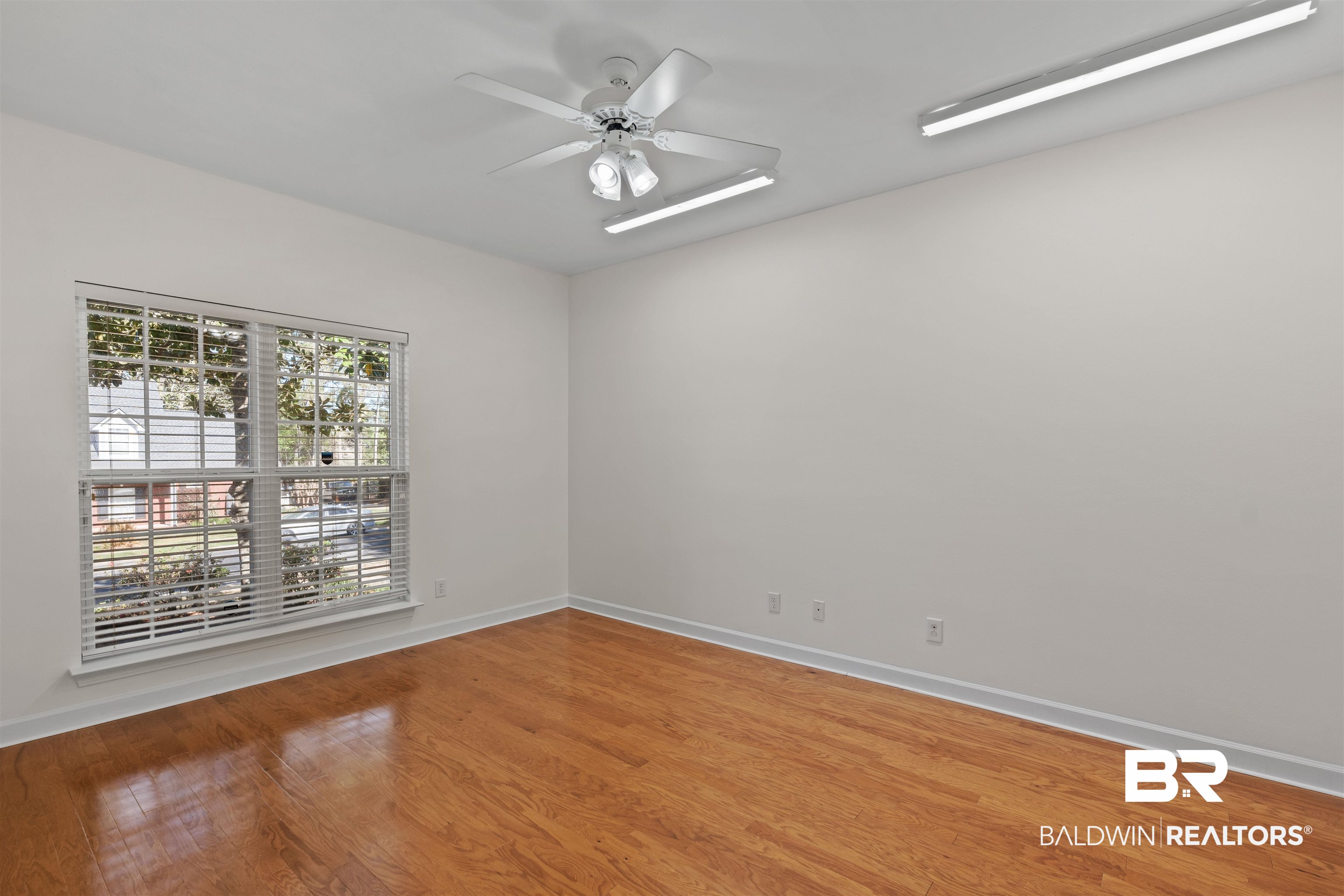 4 Judd Trail Daphne, AL 36527 - Photo 35 of 45 Empty room with ceiling fan, baseboards, and wood finished floors