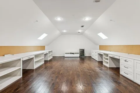 a view of a room with wooden floor and stairs