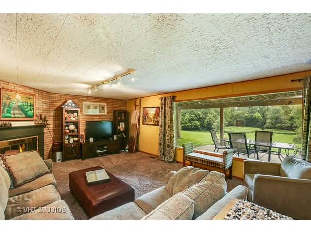 3N873 Cibis Road St. Charles, IL 60175 - Photo 7 of 19 a living room with furniture floor to ceiling window and floor to ceiling window
