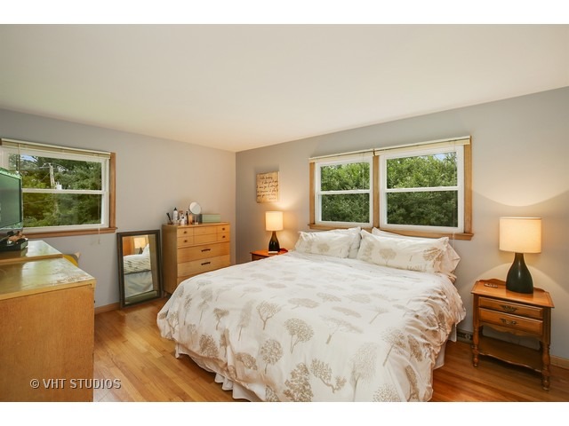 3N873 Cibis Road St. Charles, IL 60175 - Photo 10 of 19 a bedroom with a bed and a large window
