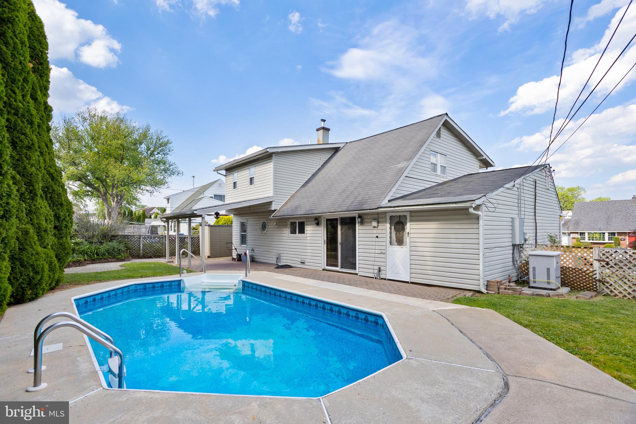 23 Cotton Road Levittown, PA 19057 - Photo 31 of 36 a front view of a house with swimming pool