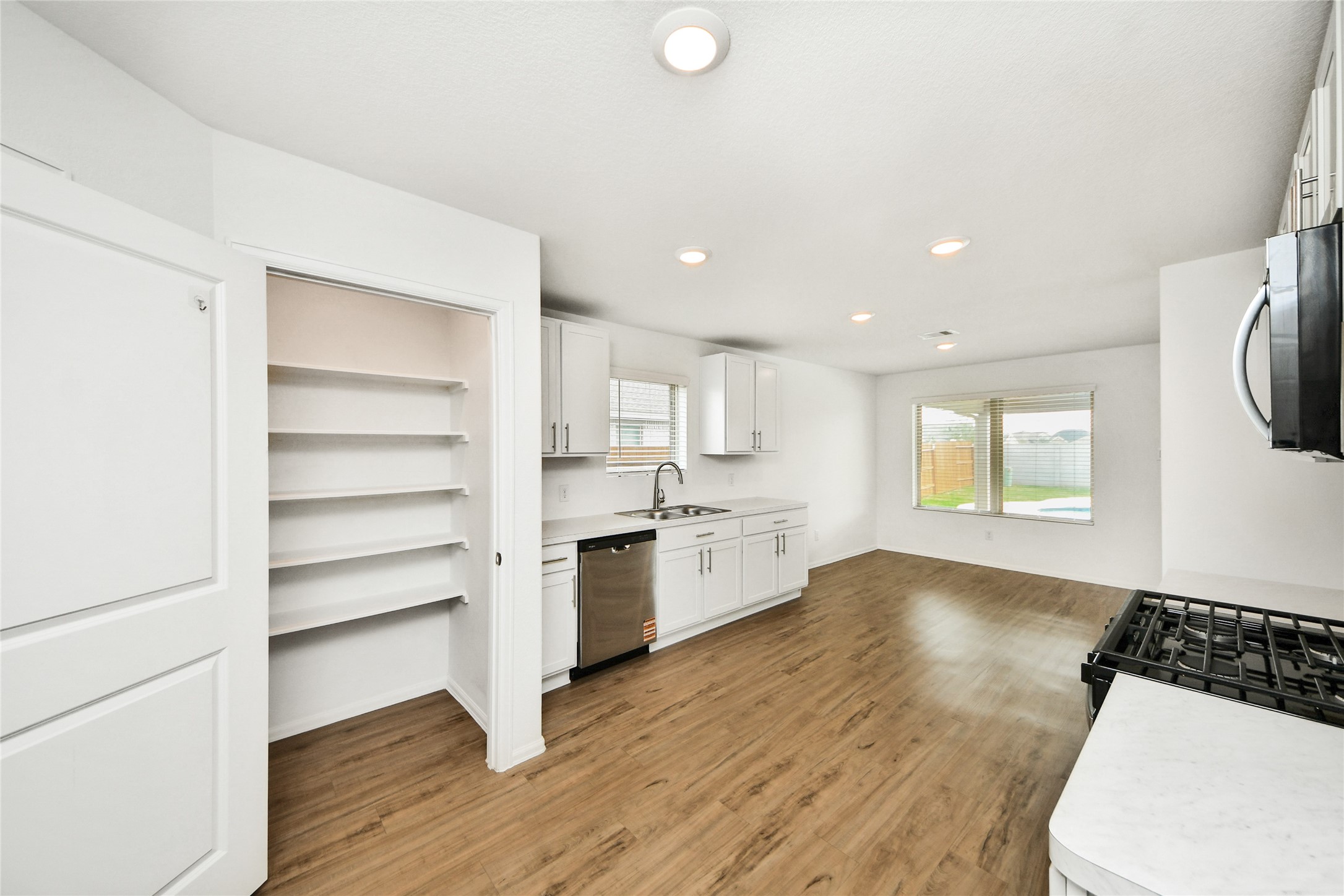 5011 Stratton Lane Rosharon, TX 77583 - Photo 14 of 38 a view of a kitchen with a sink and a stove top oven