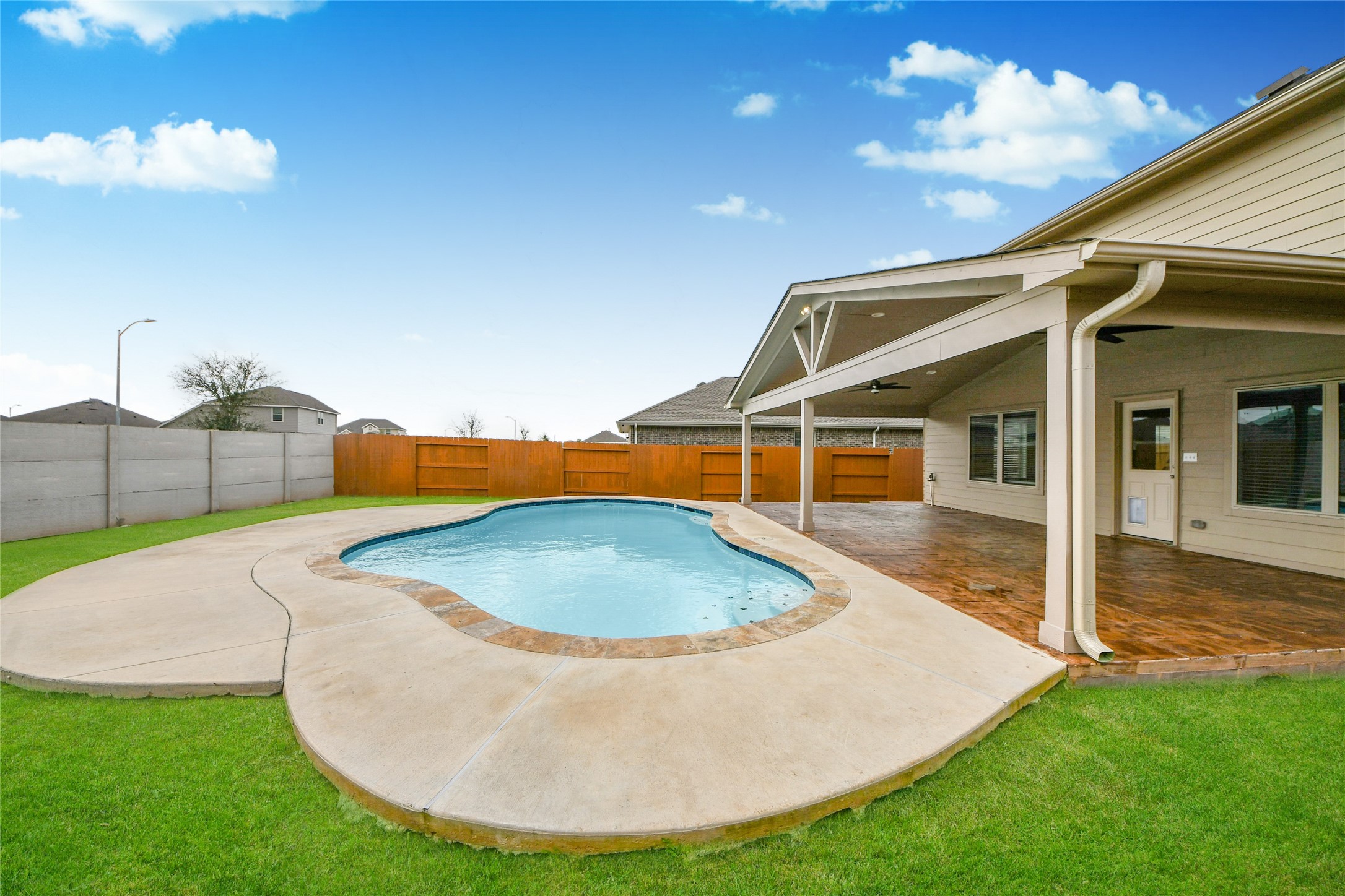 5011 Stratton Lane Rosharon, TX 77583 - Photo 30 of 38 a house view with a swimming pool