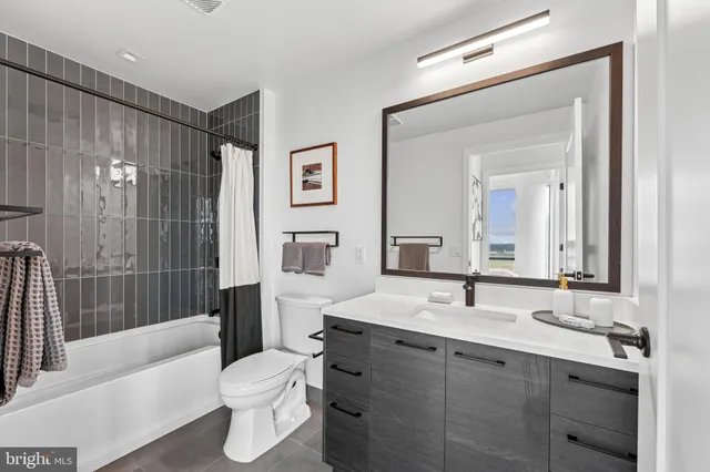 a picture of a kitchen with cabinets and window