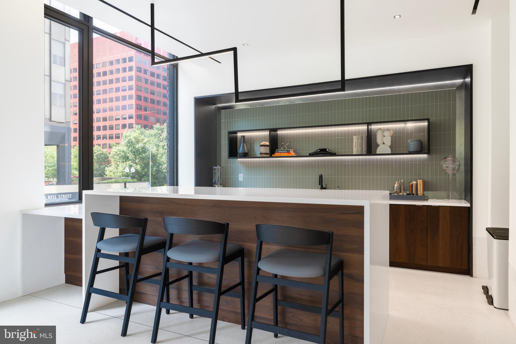 269 19th Court South, Unit 2315 Arlington, VA 22202 - Photo 21 of 48 a kitchen with a table and chairs in it