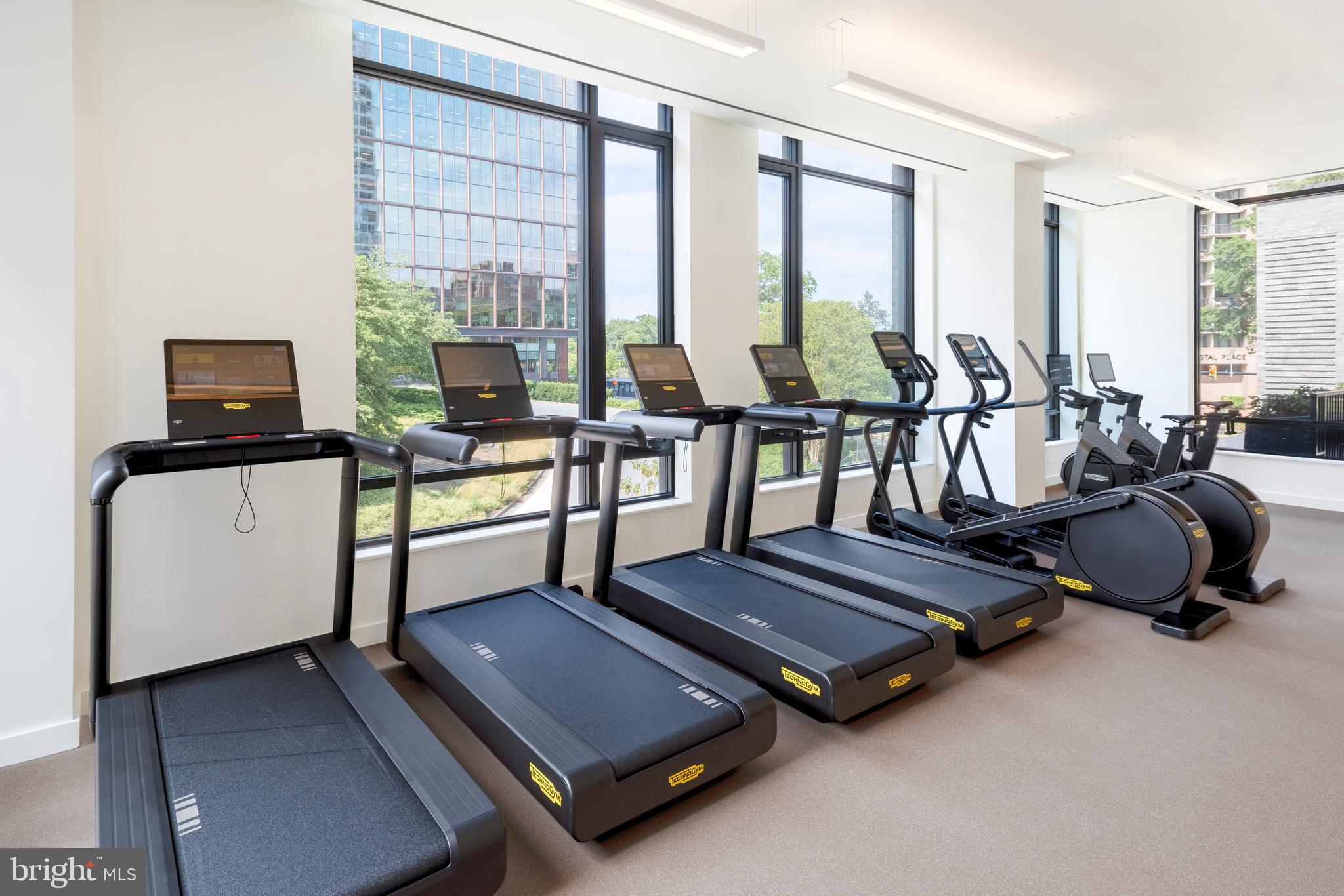 269 19th Court South, Unit 2315 Arlington, VA 22202 - Photo 25 of 48 a room with gym equipment and a large window