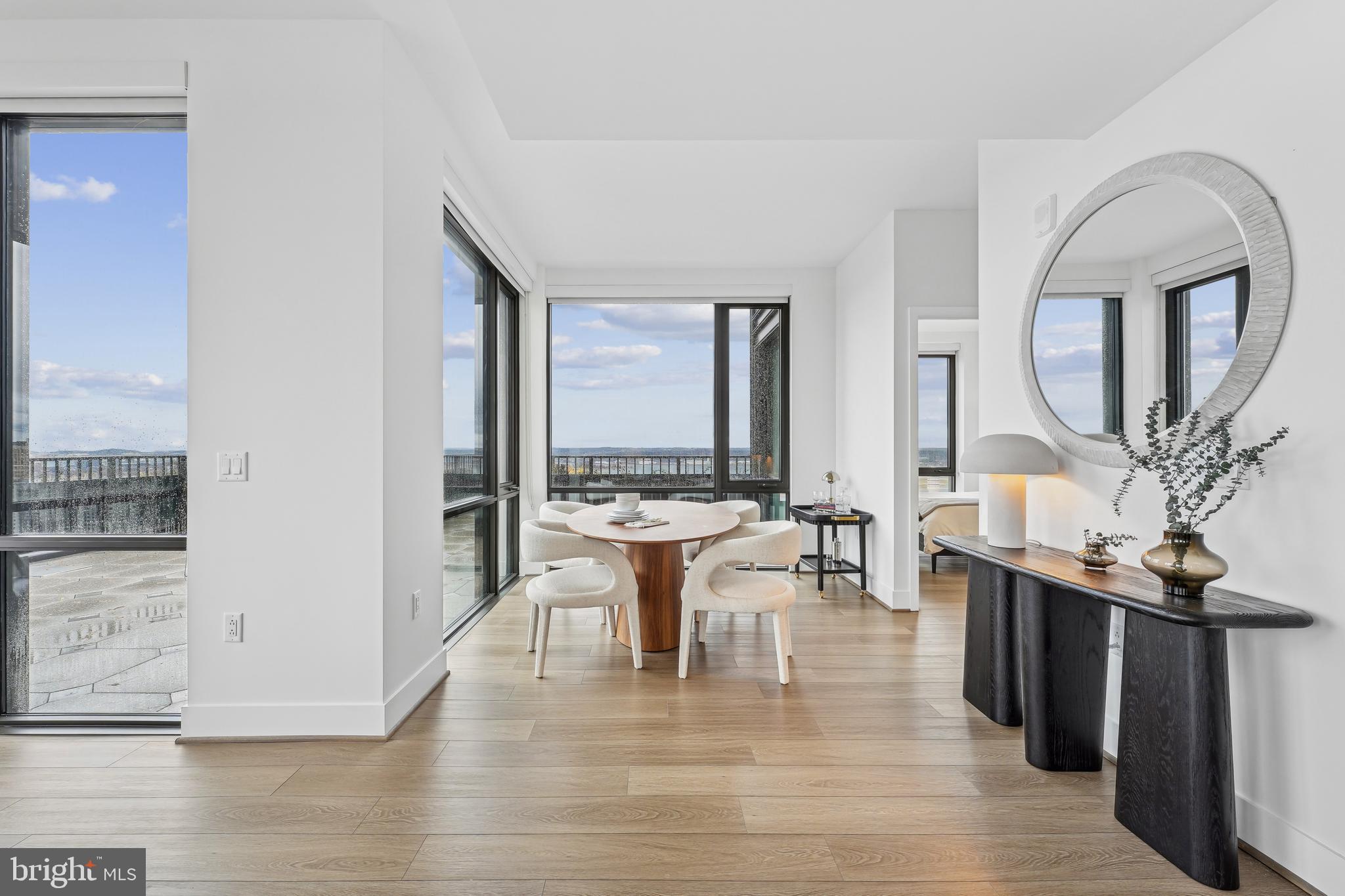 269 19th Court South, Unit 2315 Arlington, VA 22202 - Photo 5 of 48 a dining room with chandelier and wooden floor