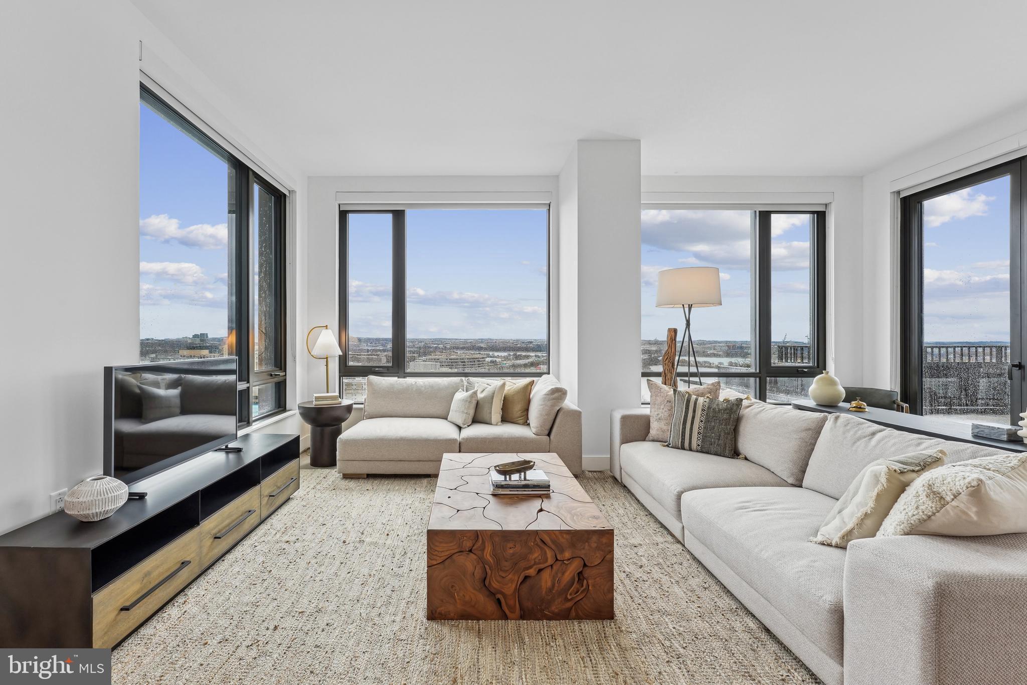 269 19th Court South, Unit 2315 Arlington, VA 22202 - Photo 6 of 48 a living room with furniture and a large window
