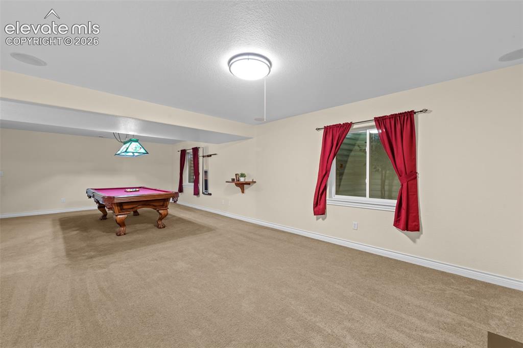 16540 Mesquite Road Peyton, CO 80831 - Photo 34 of 50 a living room with a rug