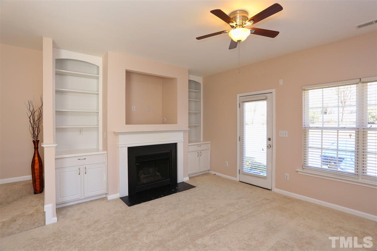 2134 Metacomet Way Raleigh, NC 27604 - Photo 11 of 25 a living room with furniture and a fireplace