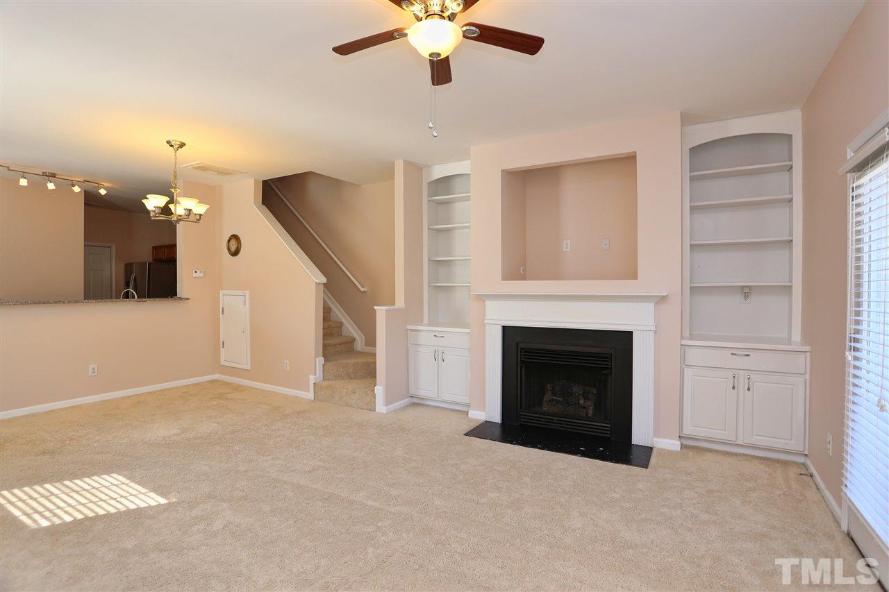 2134 Metacomet Way Raleigh, NC 27604 - Photo 12 of 25 a living room with furniture and a fireplace