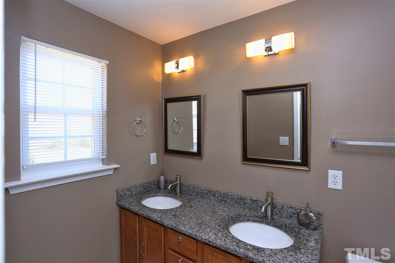 2134 Metacomet Way Raleigh, NC 27604 - Photo 15 of 25 a bathroom with 2 sink and a mirror