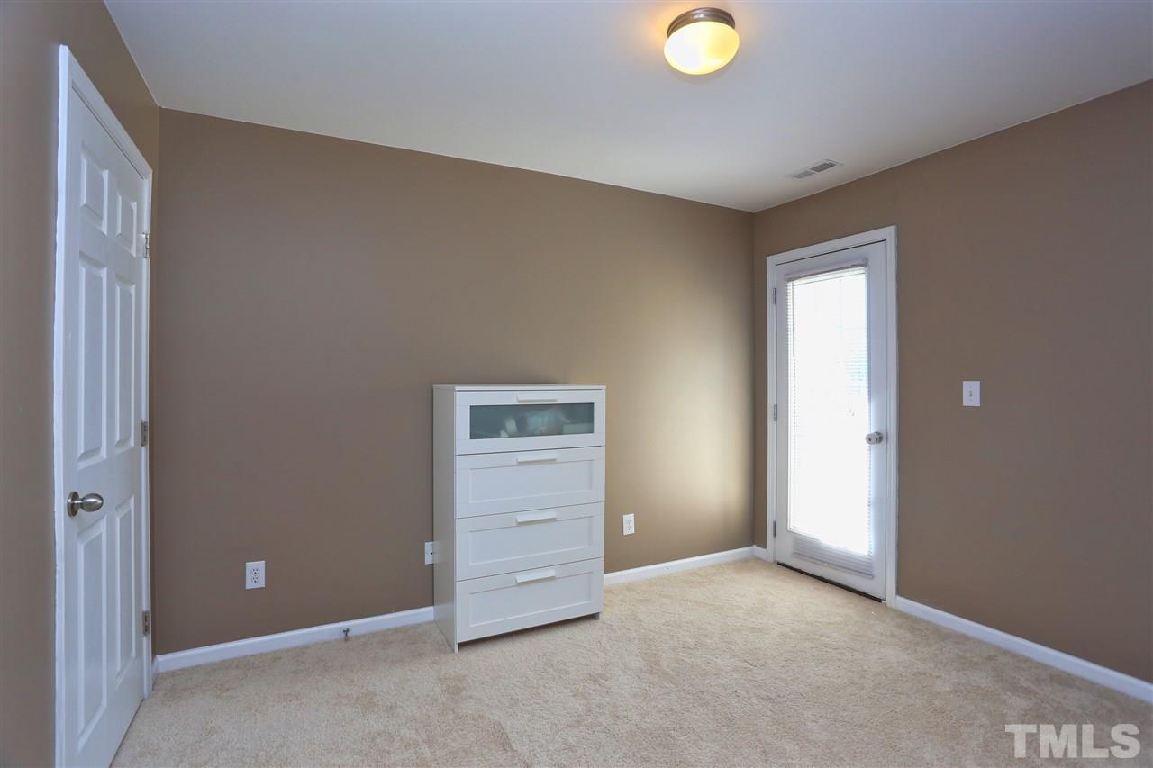 2134 Metacomet Way Raleigh, NC 27604 - Photo 19 of 25 an empty room with closet and mirror