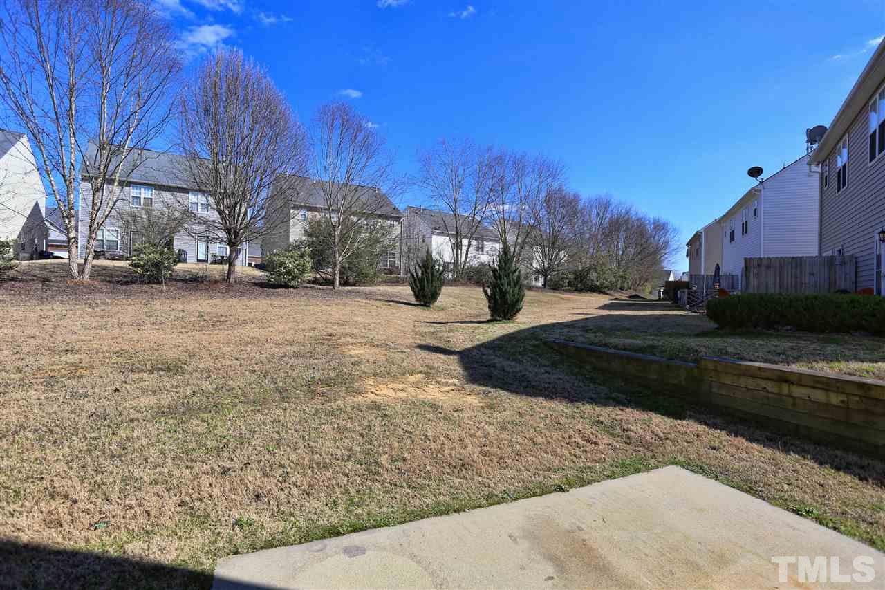 2134 Metacomet Way Raleigh, NC 27604 - Photo 22 of 25 a street view with large trees