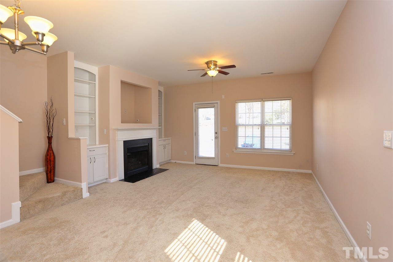 2134 Metacomet Way Raleigh, NC 27604 - Photo 10 of 25 a view of an empty room with a fireplace