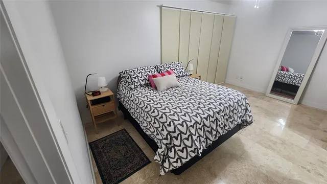 a kitchen with a sink a stove and chairs