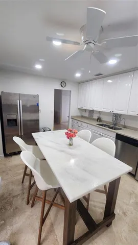 a bedroom with two beds and a lamp