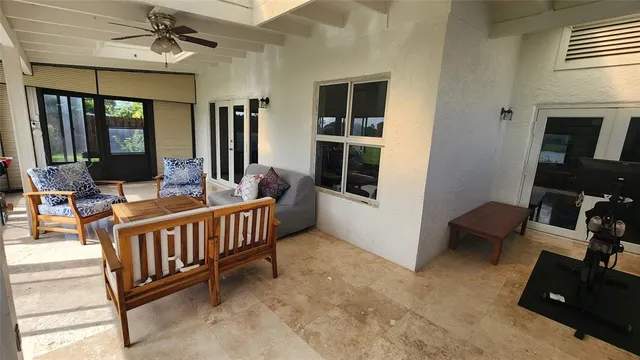 a bedroom with furniture and a window