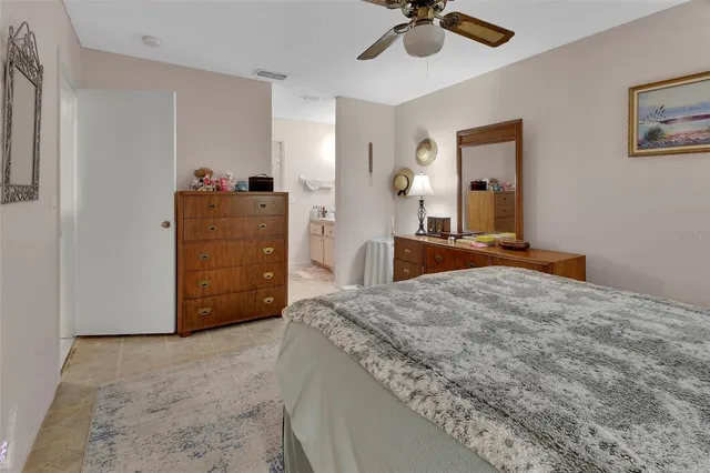 a bed room with a bed and a chandelier