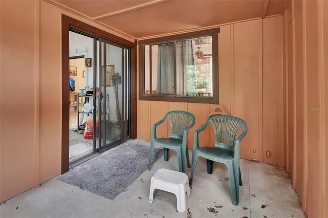 a view of a livingroom with furniture and staircase