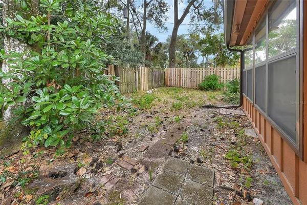 a backyard of a house with lots of green space