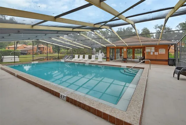 a view of a swimming pool with a porch
