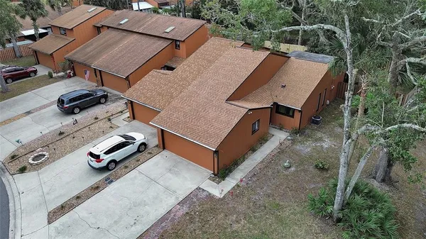 an aerial view of a house with pool