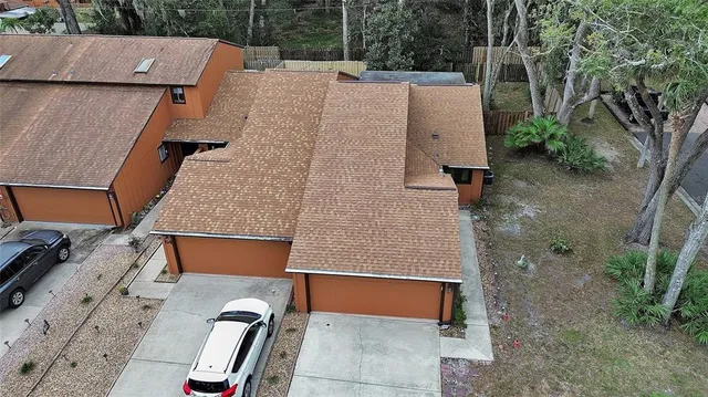 an aerial view of a house with outdoor space