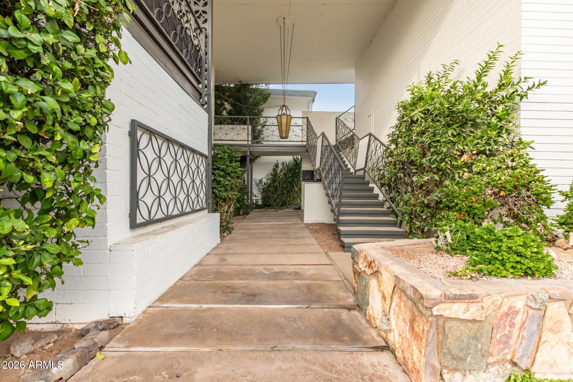 3270 East Camelback Road, Unit 213 Phoenix, AZ 85018 - Photo 1 of 41 a view of a garden with pathway