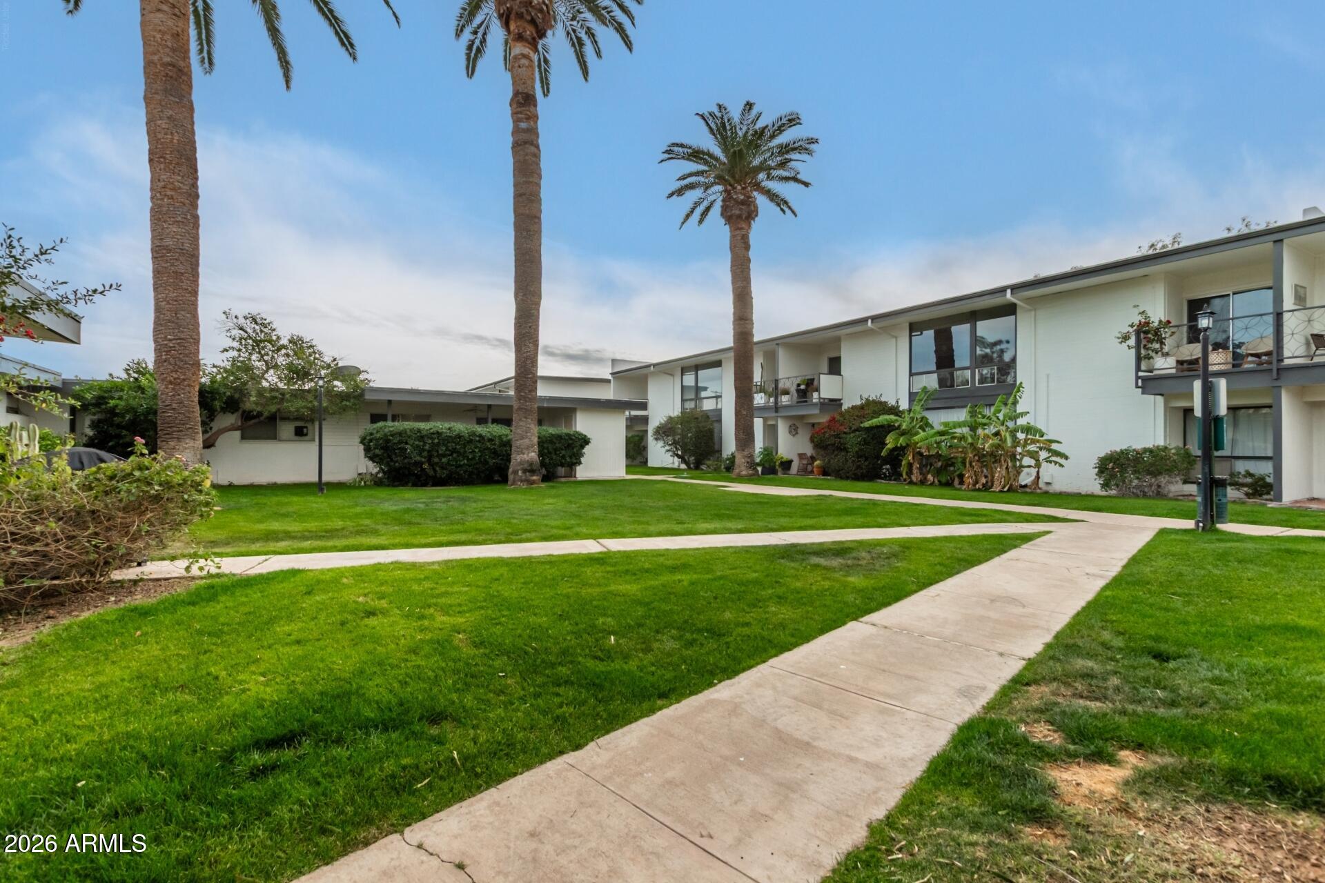 3270 East Camelback Road, Unit 213 Phoenix, AZ 85018 - Photo 37 of 41 a front view of house with yard and green space