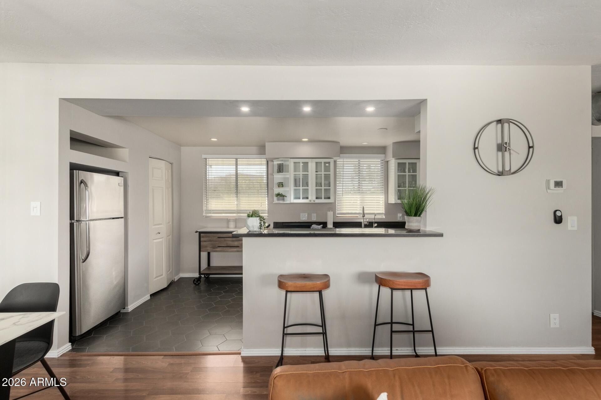 3270 East Camelback Road, Unit 213 Phoenix, AZ 85018 - Photo 9 of 41 a kitchen with table and chairs