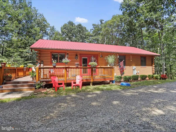 a view of a house with backyard and porch