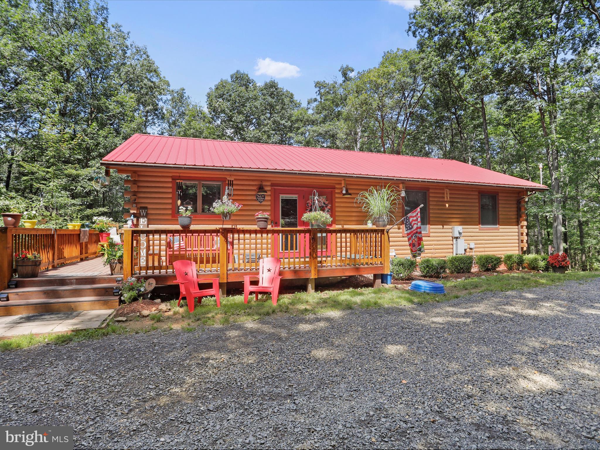 480 High Mountain Road Romney, WV 26757 - Photo 1 of 46 a view of a house with backyard and porch