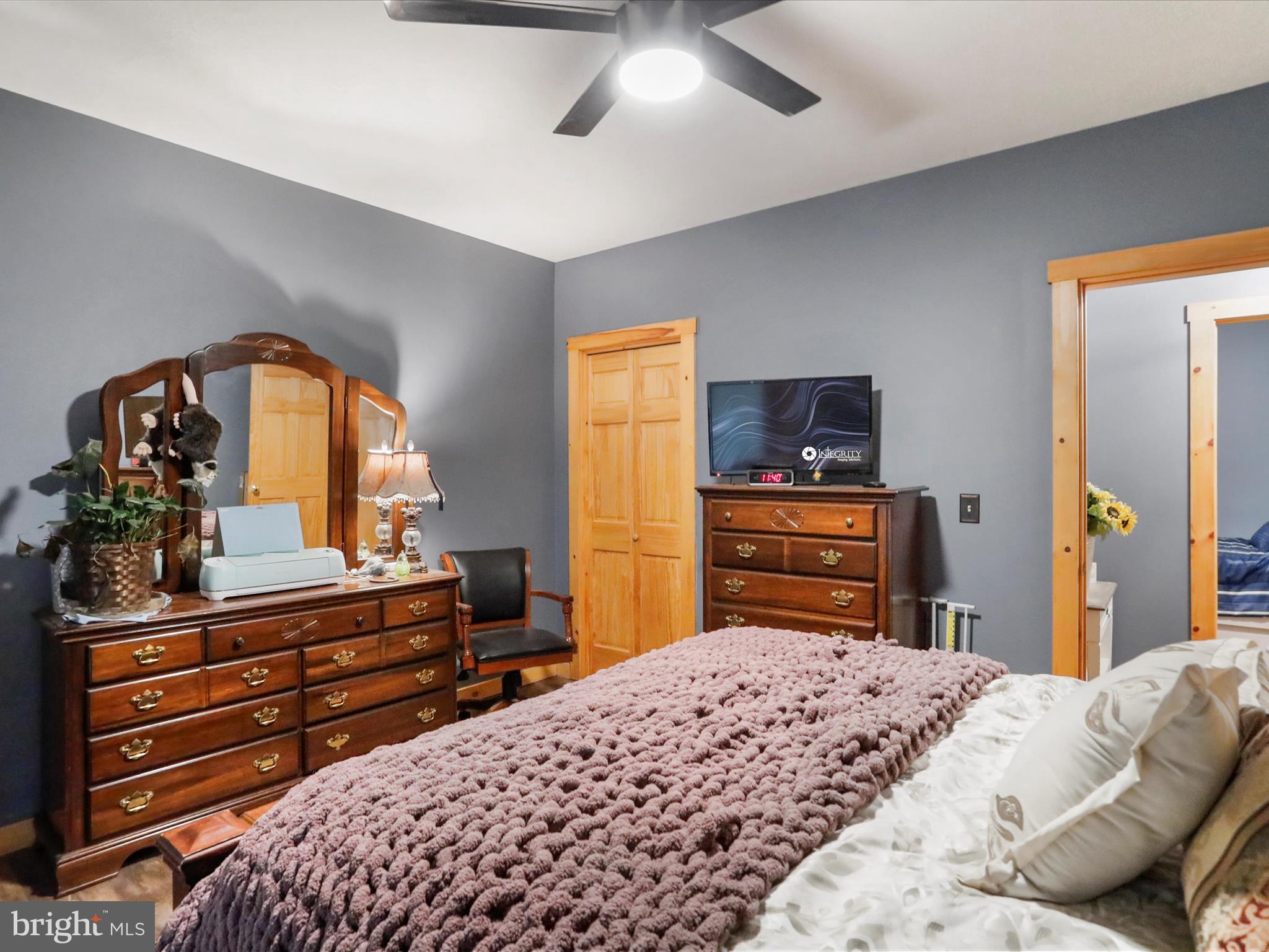 480 High Mountain Road Romney, WV 26757 - Photo 13 of 46 a bedroom with a bed and a television