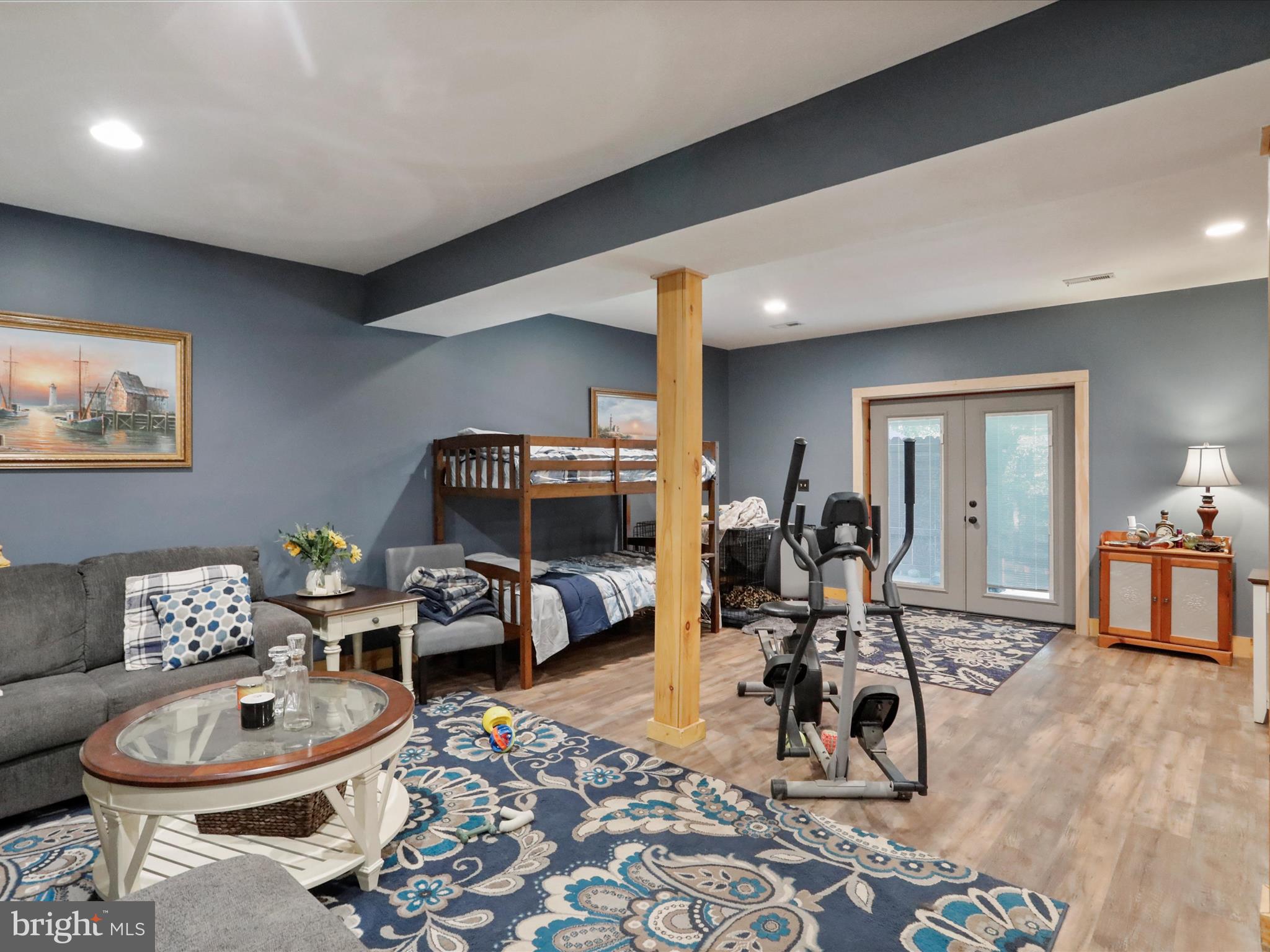 480 High Mountain Road Romney, WV 26757 - Photo 19 of 46 a room with furniture a rug and gym equipment
