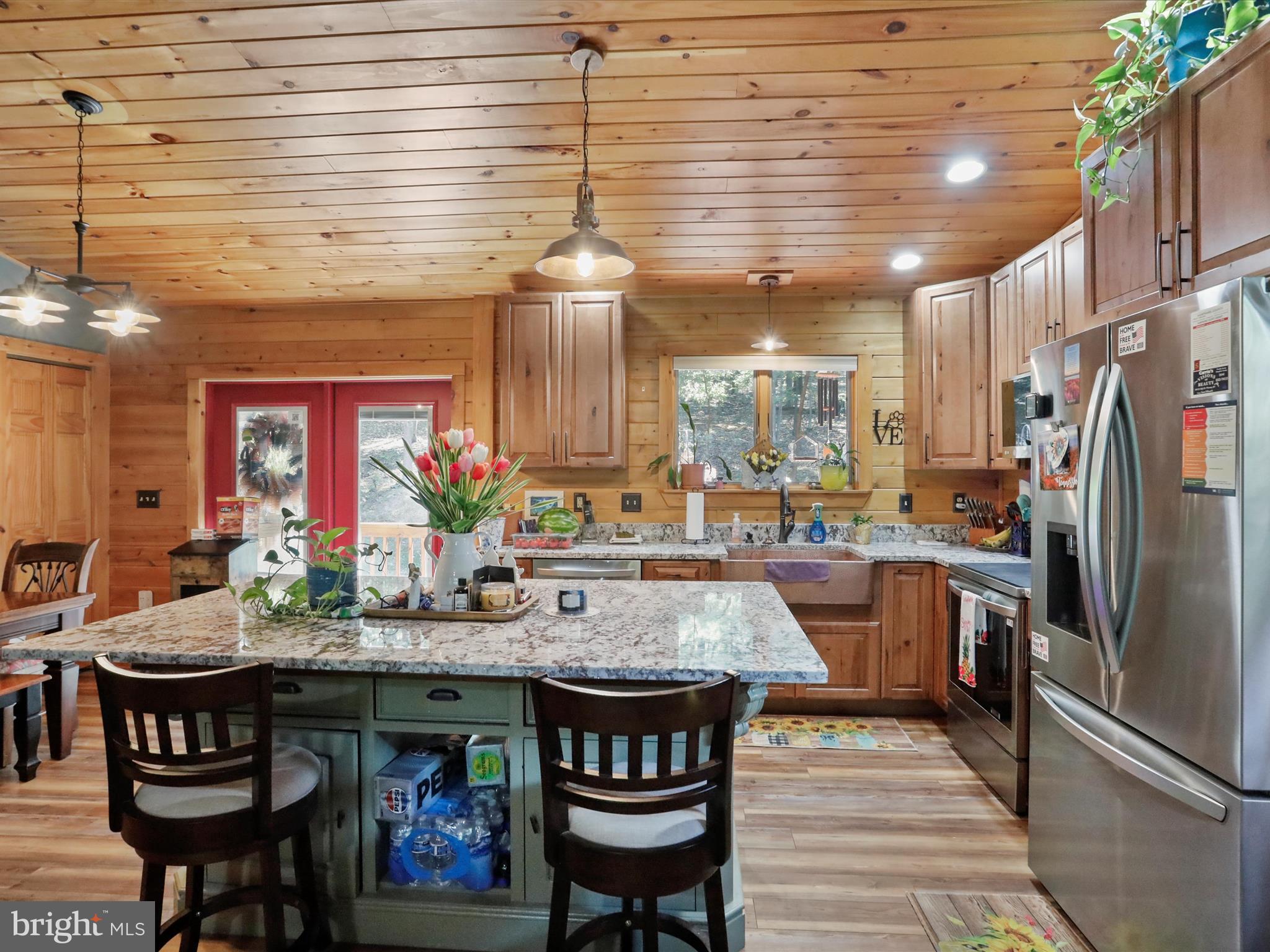 480 High Mountain Road Romney, WV 26757 - Photo 21 of 46 a large kitchen with a table and chairs