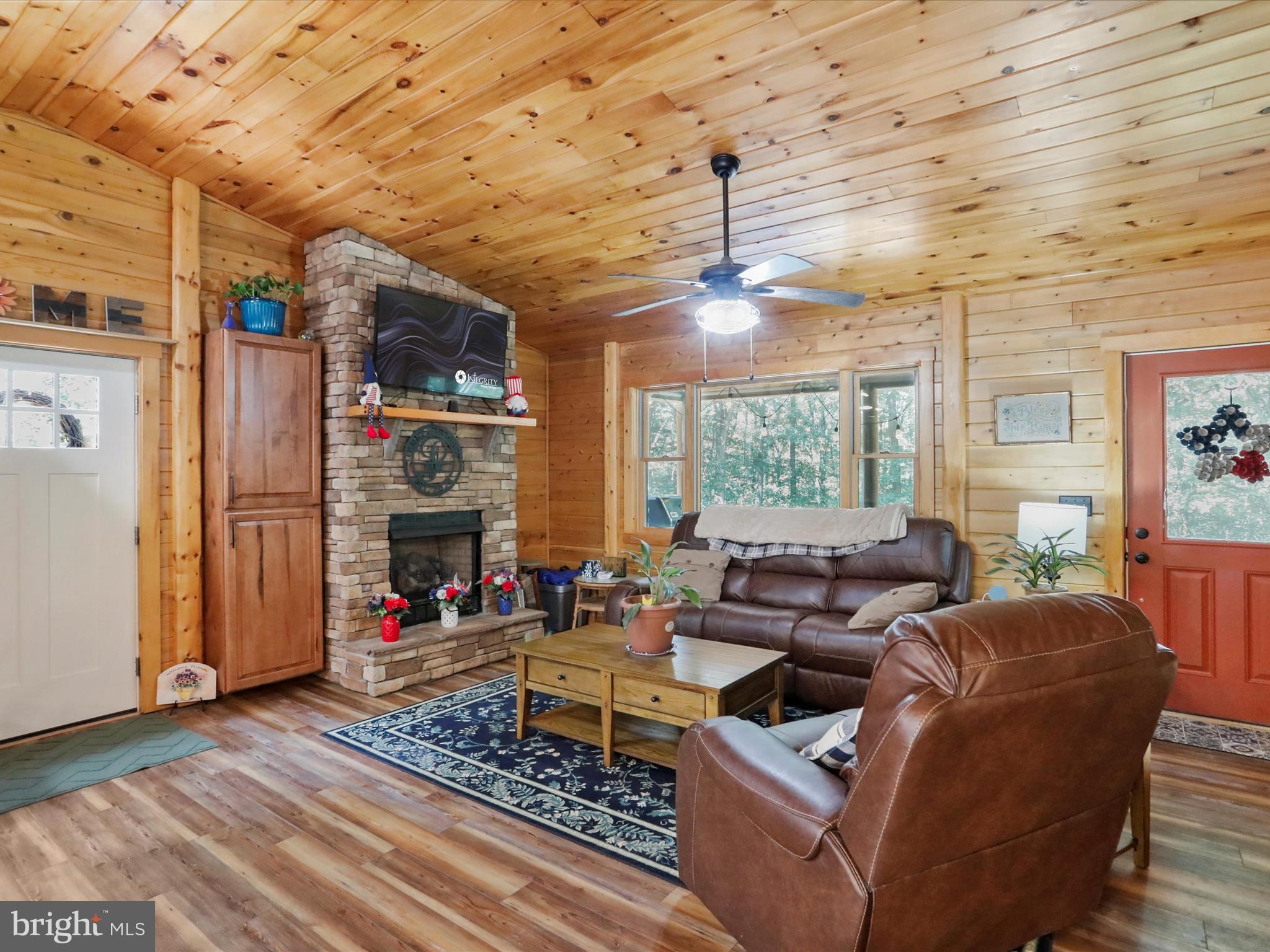 480 High Mountain Road Romney, WV 26757 - Photo 26 of 46 a living room with furniture and a fireplace
