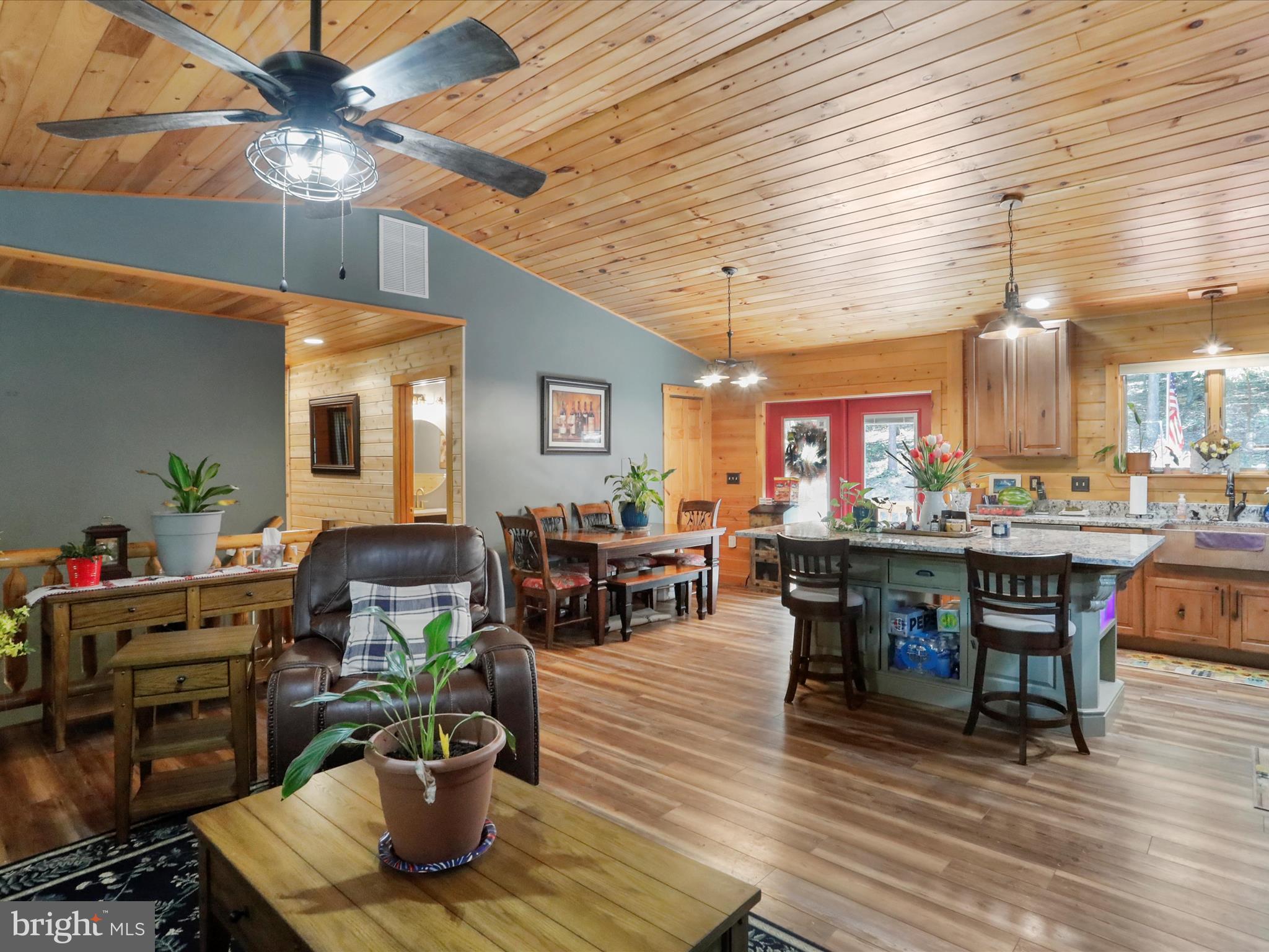 480 High Mountain Road Romney, WV 26757 - Photo 28 of 46 a living room with lots of furniture and kitchen view