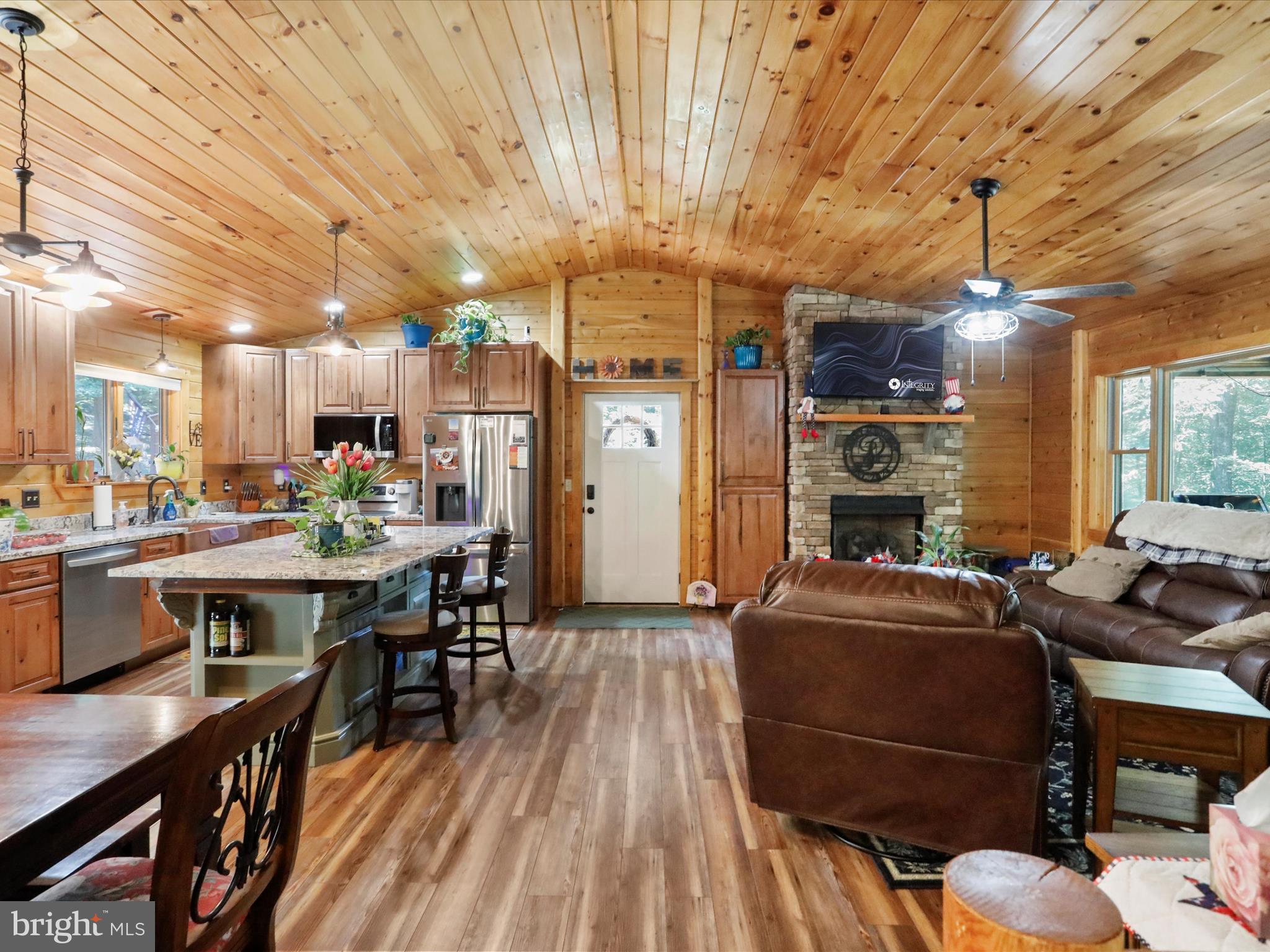 480 High Mountain Road Romney, WV 26757 - Photo 29 of 46 a view of a dining room with furniture window and wooden floor