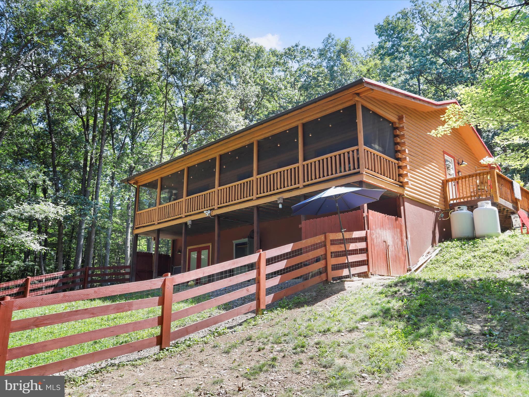 480 High Mountain Road Romney, WV 26757 - Photo 32 of 46 a front view of a house with a yard