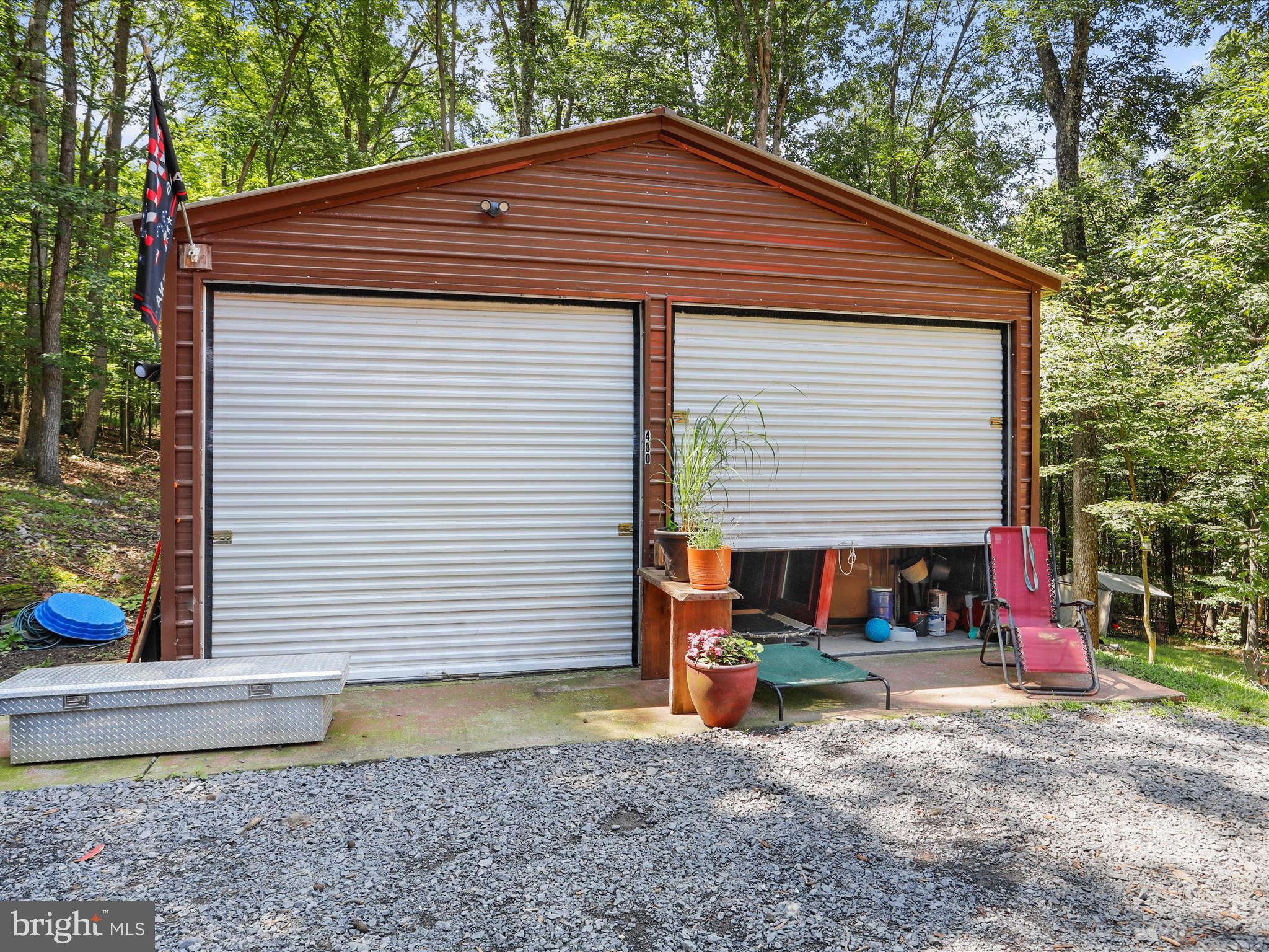 480 High Mountain Road Romney, WV 26757 - Photo 33 of 46 a backyard of a house with barbeque oven table and chairs