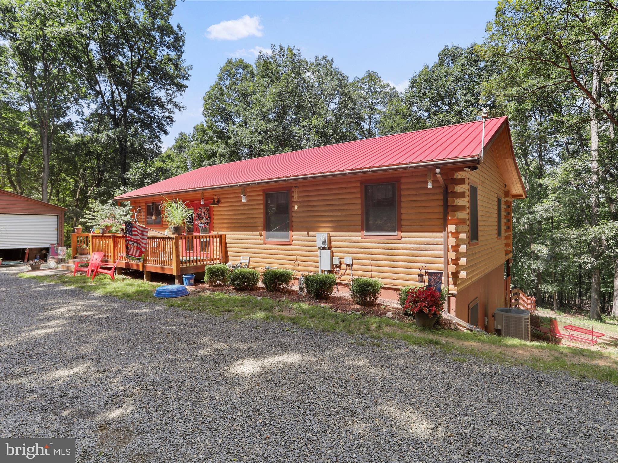 480 High Mountain Road Romney, WV 26757 - Photo 4 of 46 a view of a house with a yard