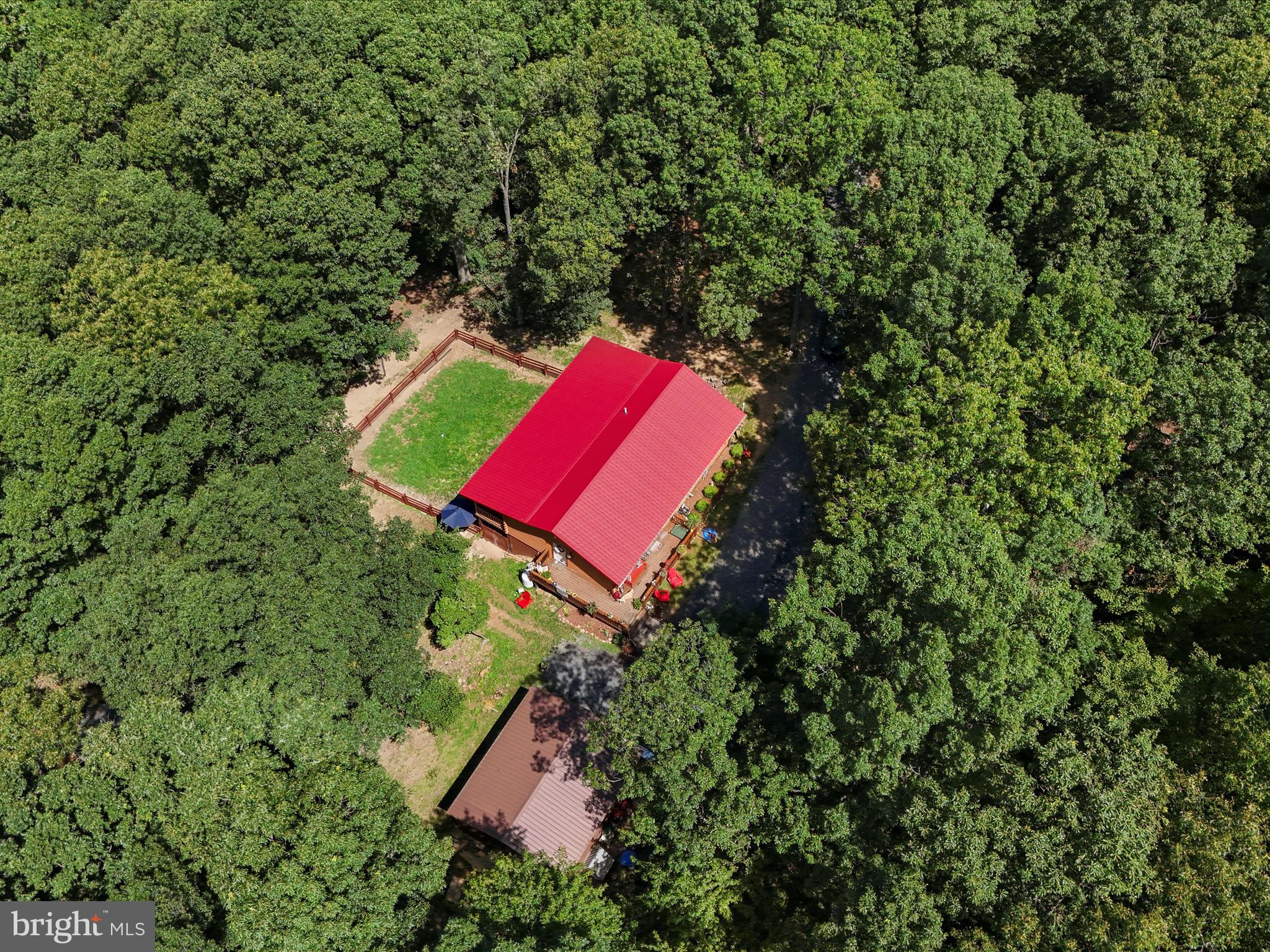 480 High Mountain Road Romney, WV 26757 - Photo 41 of 46 an aerial view of a house with a yard and a large tree