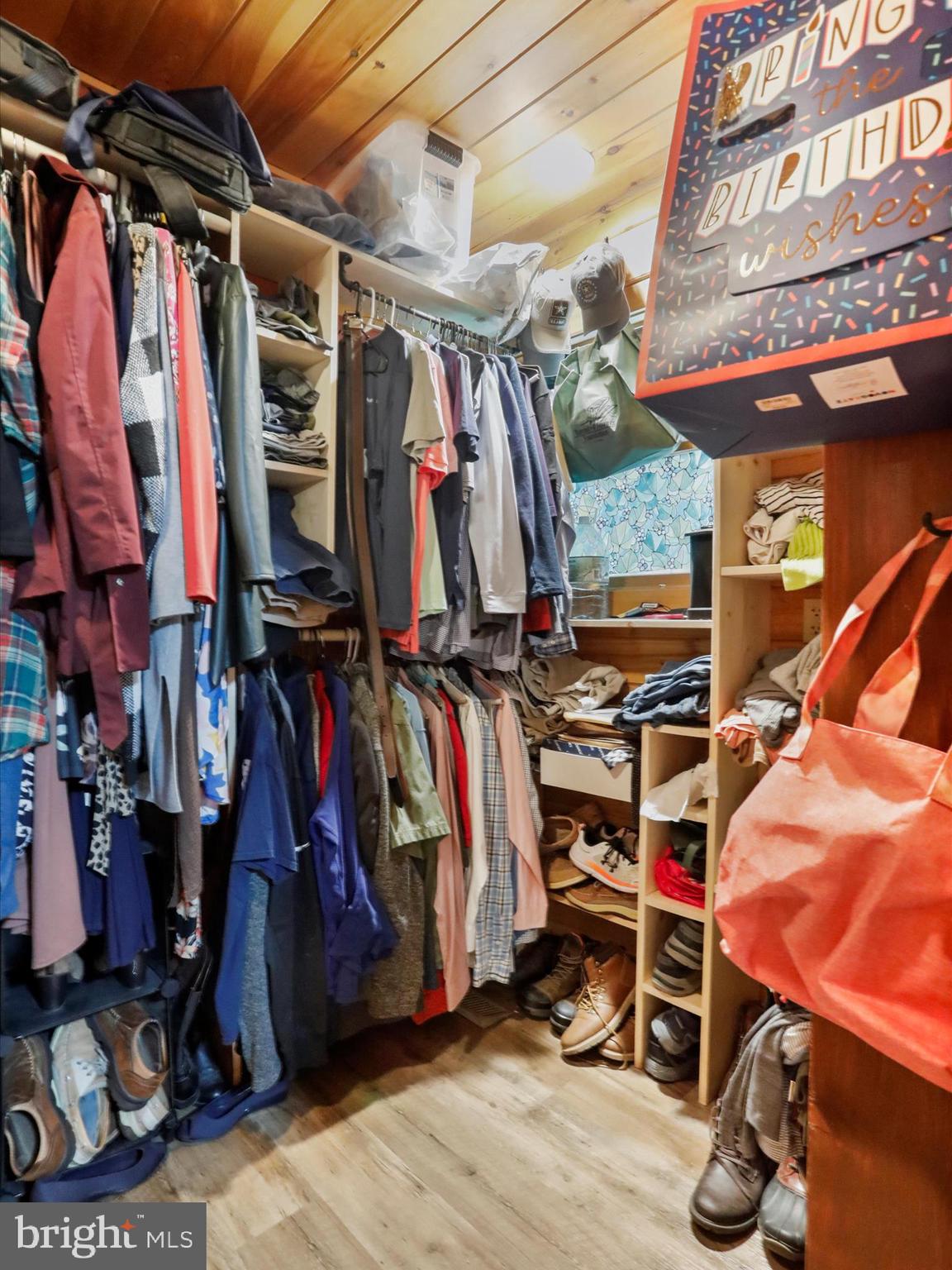 480 High Mountain Road Romney, WV 26757 - Photo 6 of 46 a view of walk in closet with clothes and shoes
