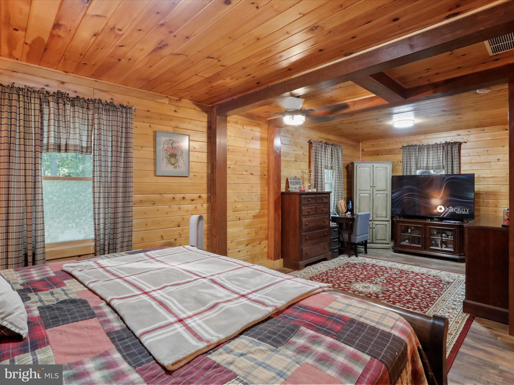 480 High Mountain Road Romney, WV 26757 - Photo 7 of 46 a bedroom with a bed and a flat screen tv