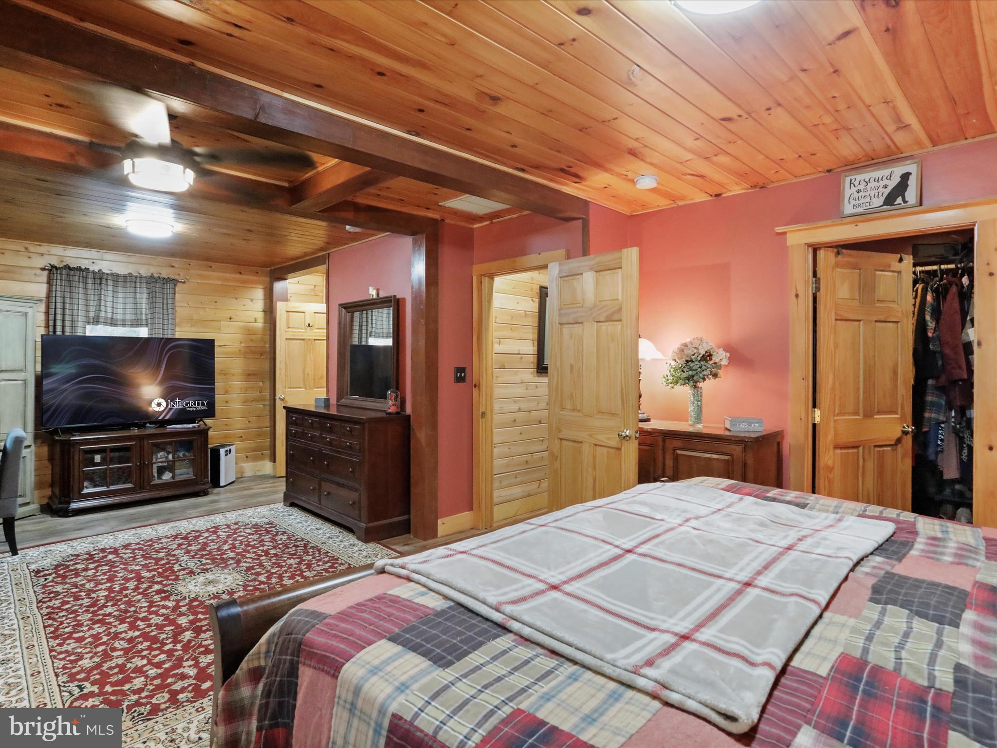 480 High Mountain Road Romney, WV 26757 - Photo 8 of 46 a bedroom with a bed and a flat screen tv