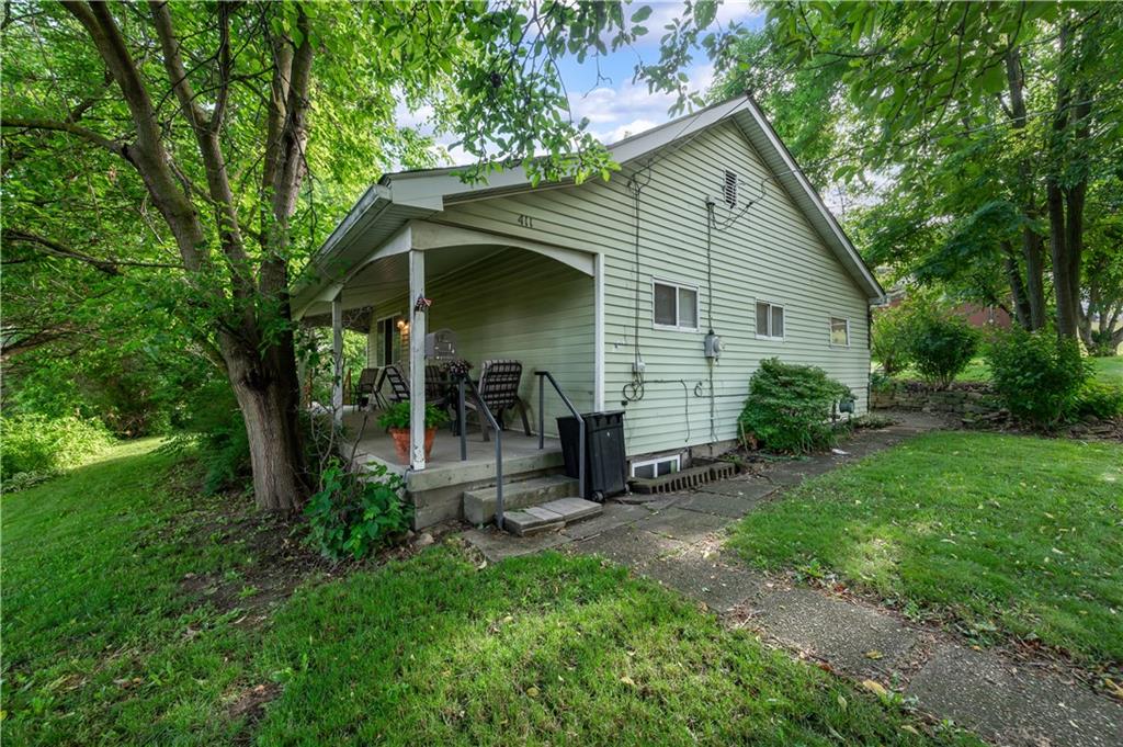 411 Harmony Road Baden, PA 15005 - Photo 2 of 25 a view of a small house with yard and tree s