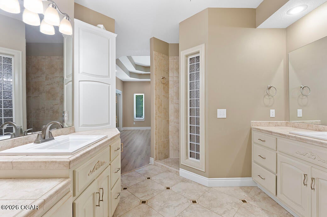 2804 East Ridge View Court Joplin, MO 64801 - Photo 20 of 47 en suite 2 vanities view into primary